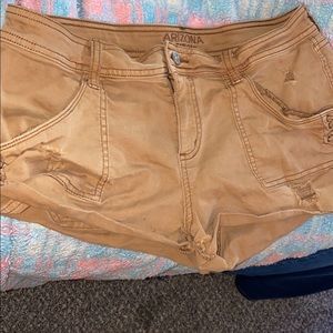 Tan ripped shorts (really short)